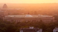 Parliament building at sunset under pollution and smog in New Delhi, Delhi, India, Delhi.